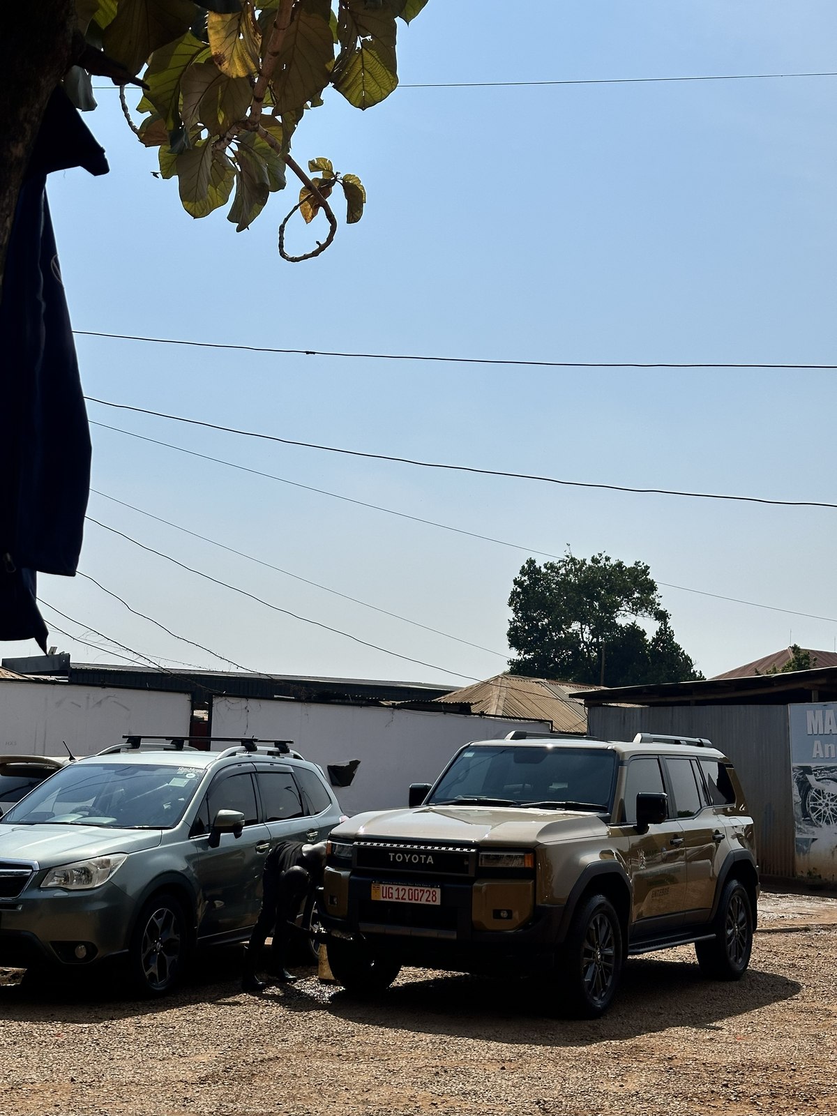 Customer vehicles parked at Makanga Auto Centre's workshop